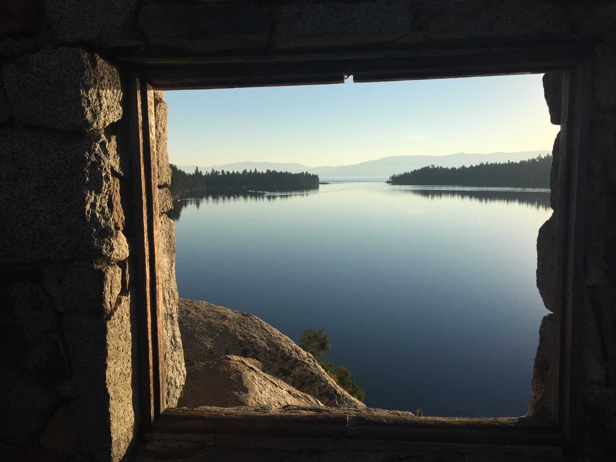 Emerald Bay seen through a stone-framed window on Fannette Island