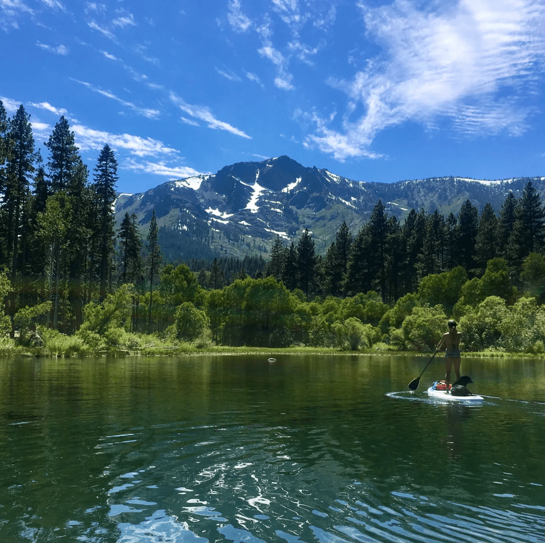Paddleboarder on Fallen Leaf Lake beneath Mt. Tallac