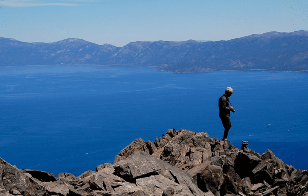 Hiker overlooking Lake Tahoe from the Mt. Tallac trail